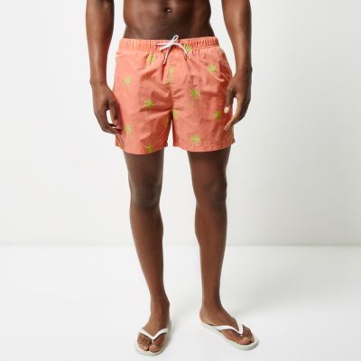 Pink palm tree print swim shorts